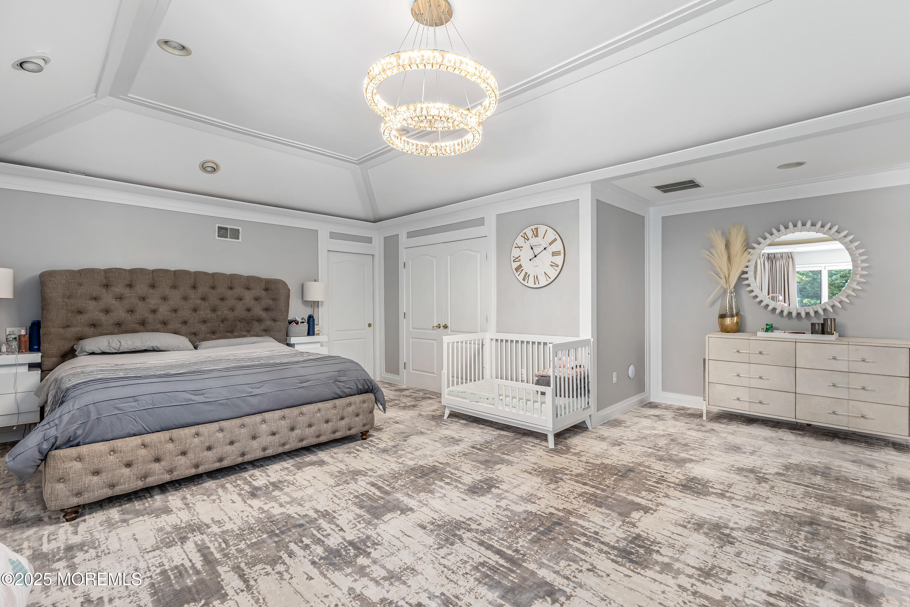 806 Turquoise Trail Morganville, NJ 07751 - Photo 21 of 62 a spacious bedroom with a bed a mirror and couch