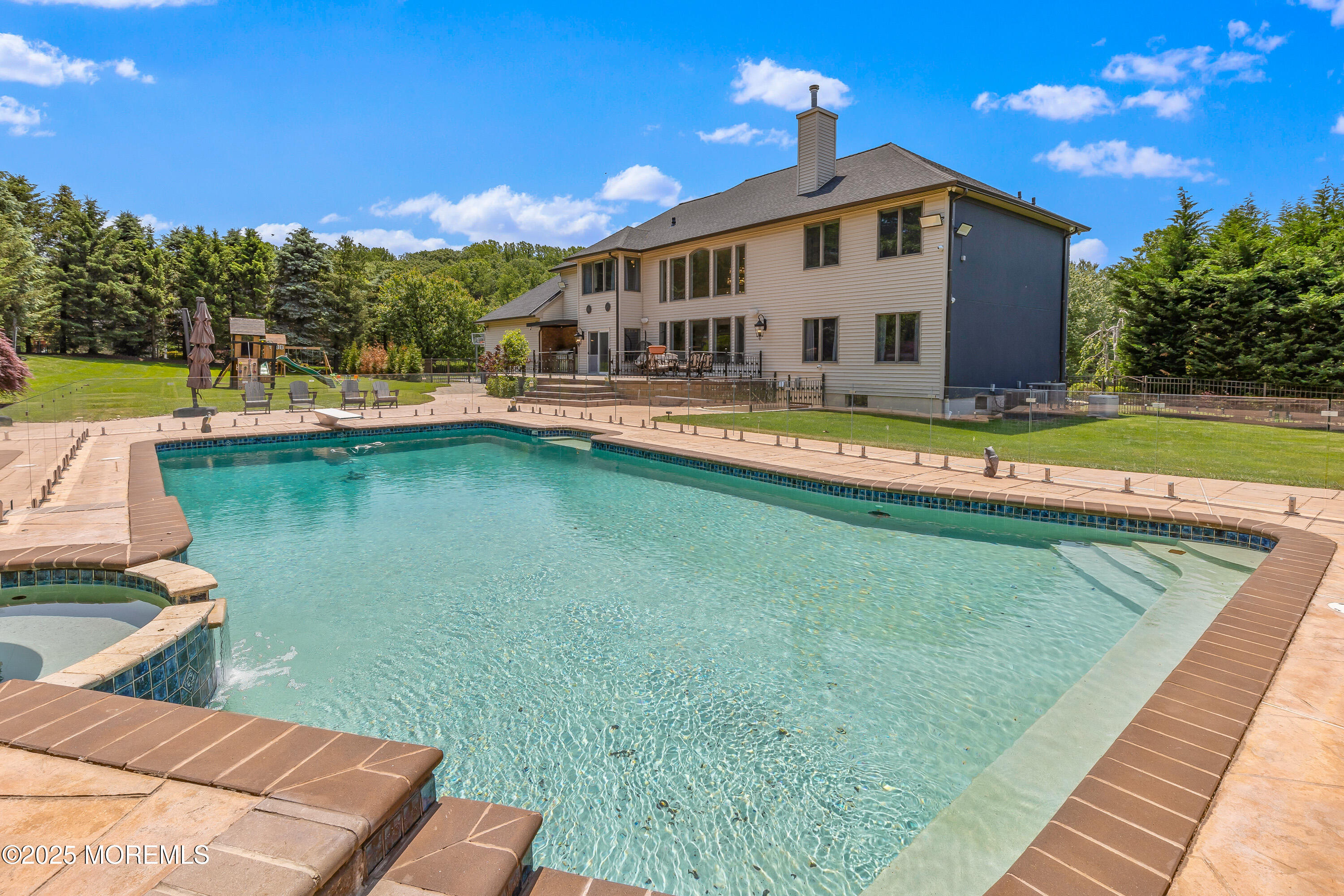 806 Turquoise Trail Morganville, NJ 07751 - Photo 29 of 62 a view of a house with swimming pool