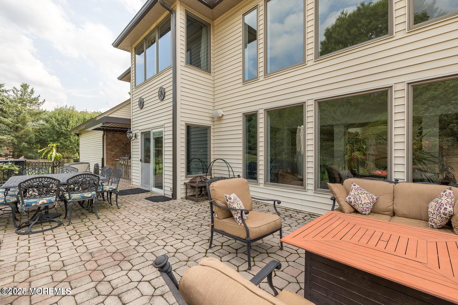 806 Turquoise Trail Morganville, NJ 07751 - Photo 34 of 62 a balcony with furniture and a potted plant