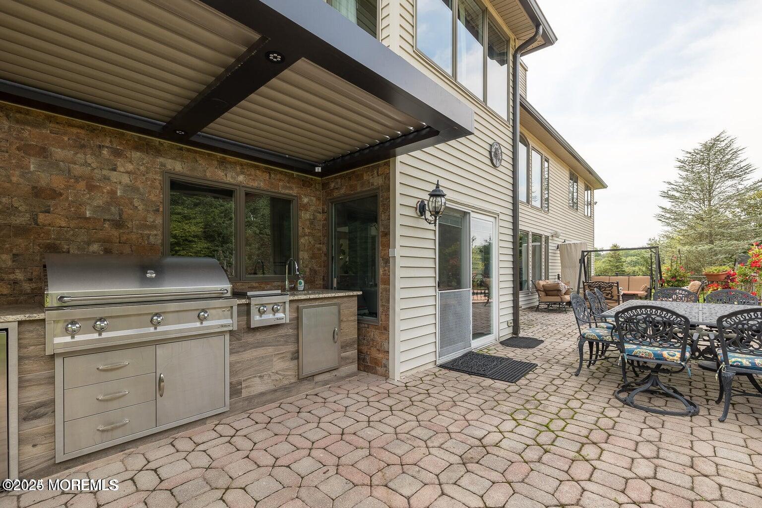 806 Turquoise Trail Morganville, NJ 07751 - Photo 35 of 62 a view of a chairs and table in the patio