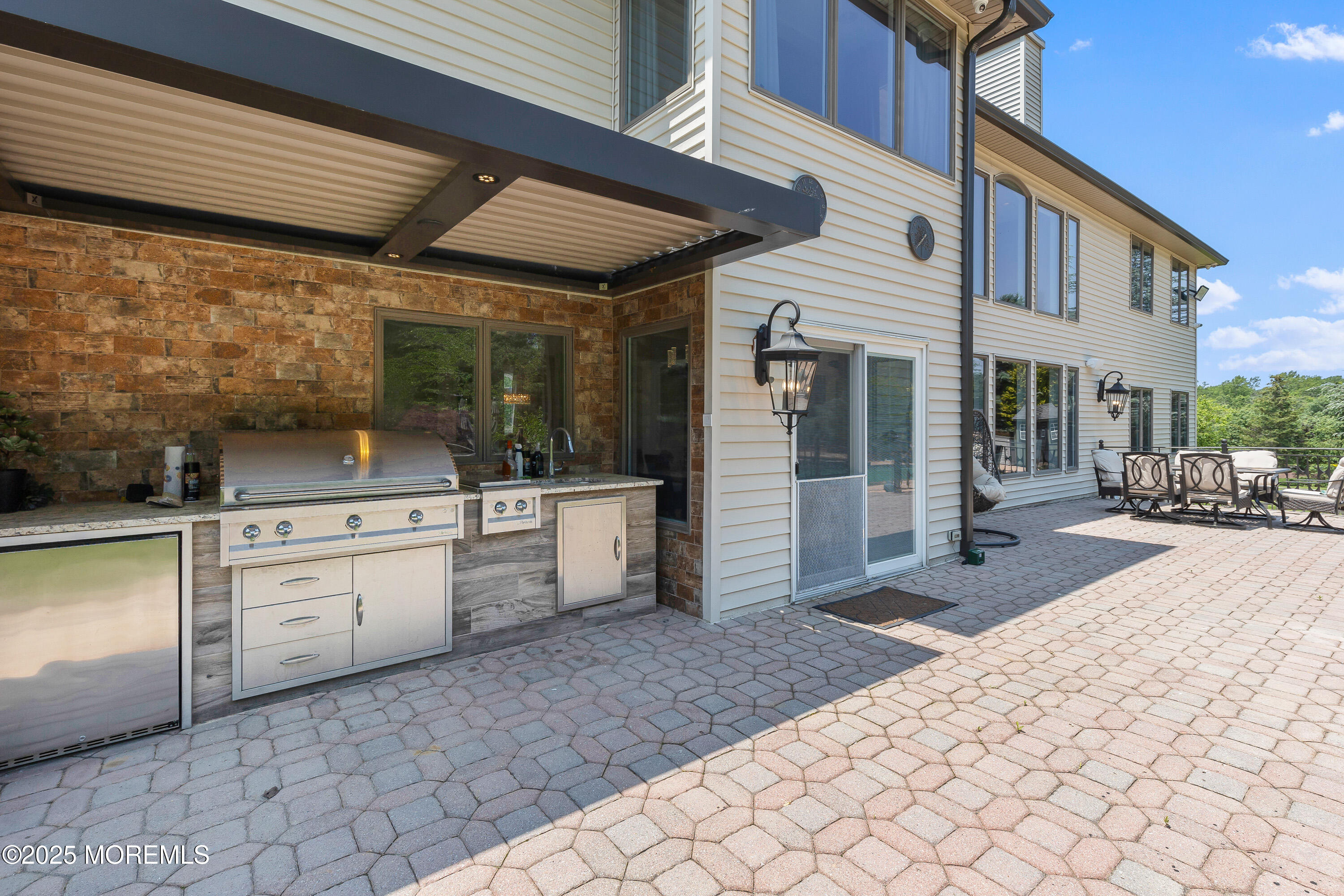 806 Turquoise Trail Morganville, NJ 07751 - Photo 36 of 62 a view of a chairs and table in the patio