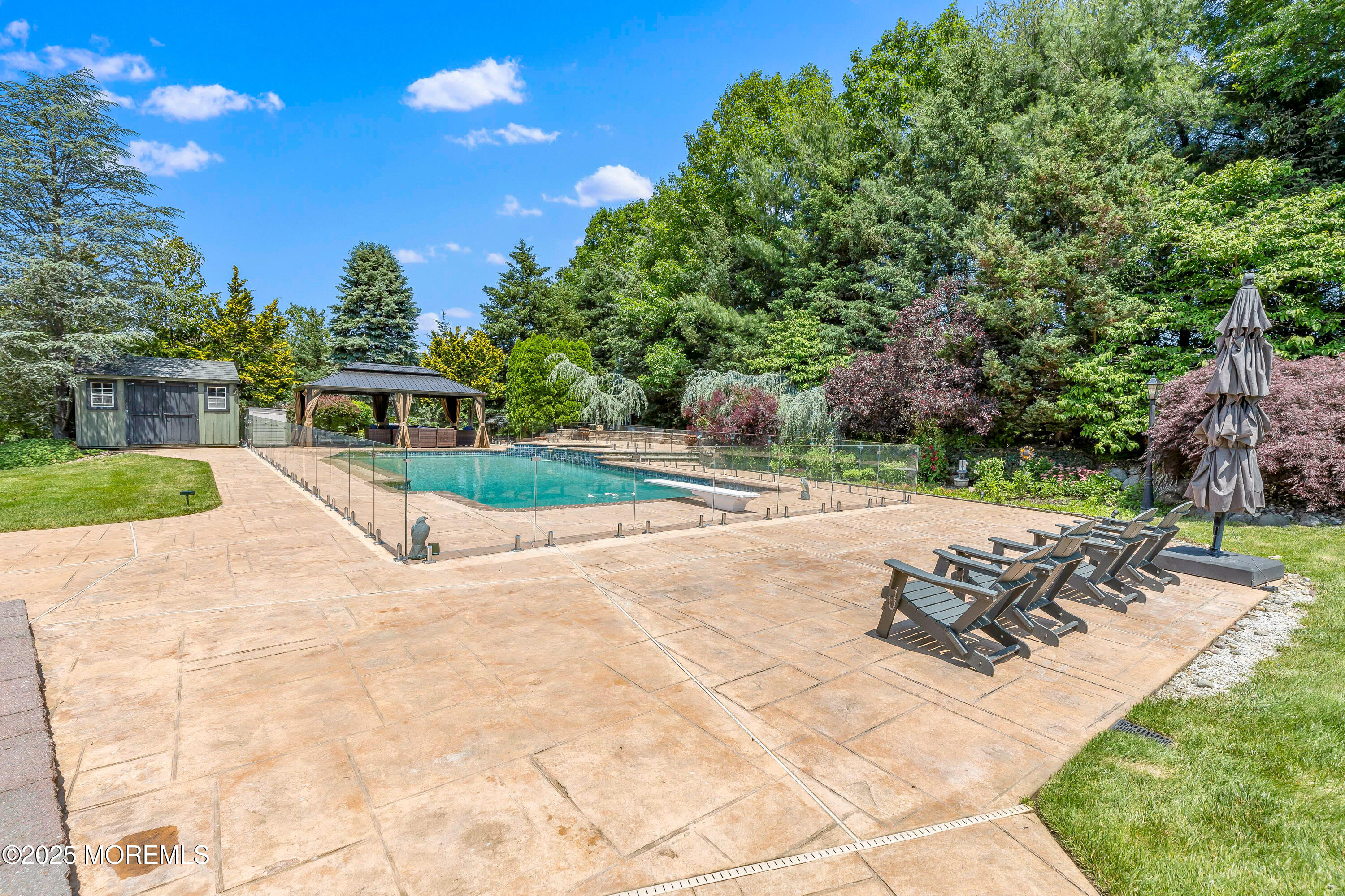 806 Turquoise Trail Morganville, NJ 07751 - Photo 38 of 62 a view of a backyard with sitting area