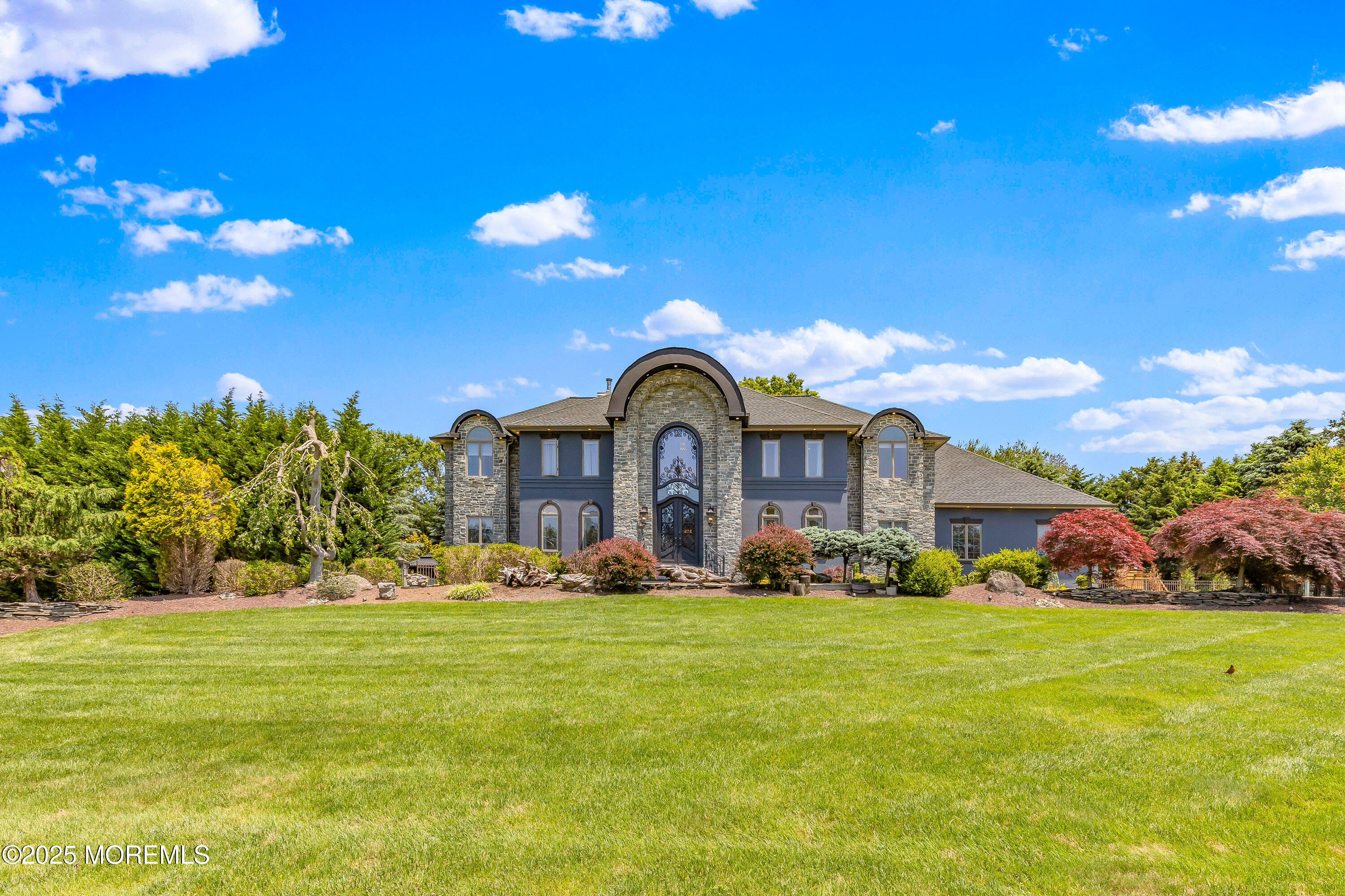 806 Turquoise Trail Morganville, NJ 07751 - Photo 47 of 62 a front view of a house with a yard