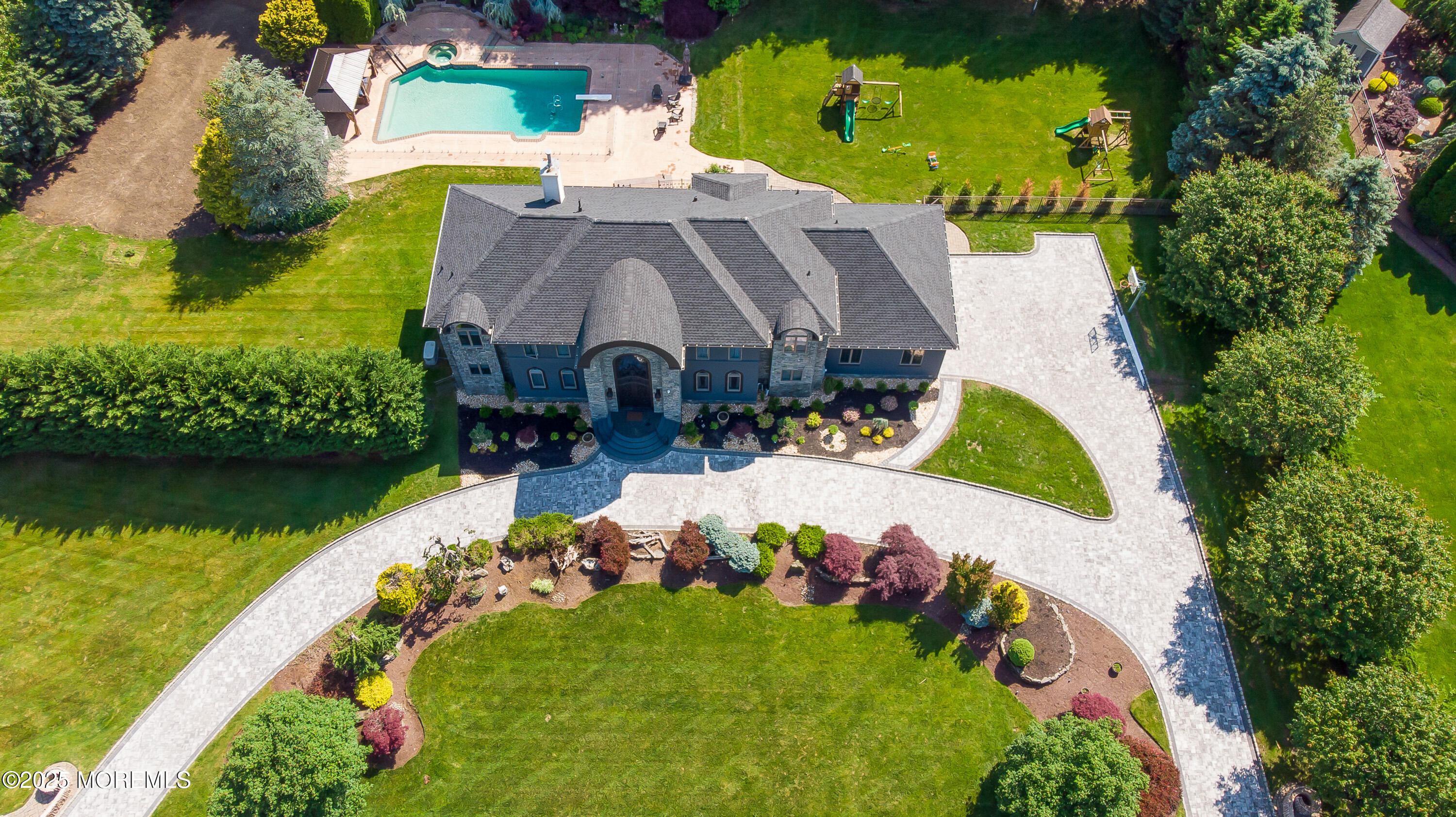 806 Turquoise Trail Morganville, NJ 07751 - Photo 49 of 62 an aerial view of a house with a garden and lake view
