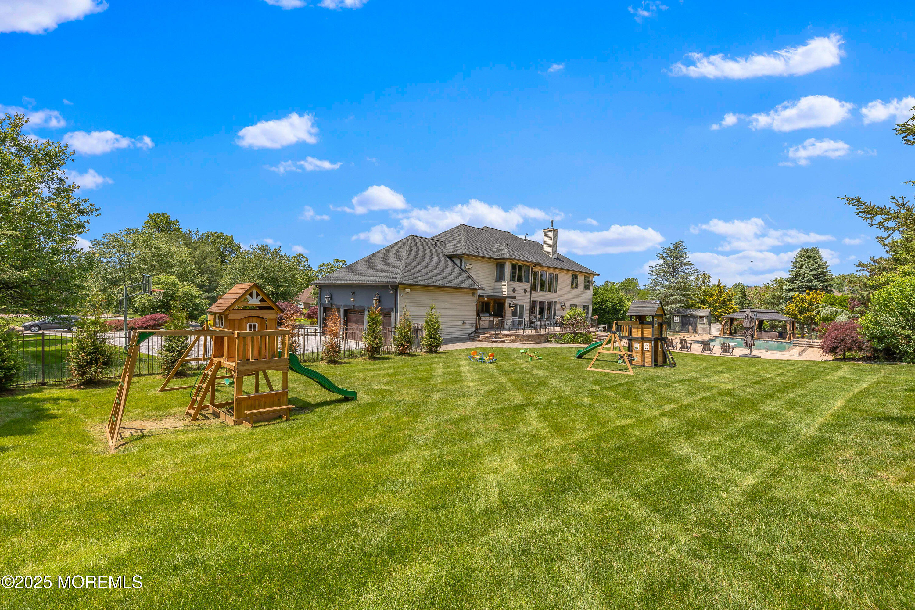 806 Turquoise Trail Morganville, NJ 07751 - Photo 55 of 62 a view of a house with a swimming pool