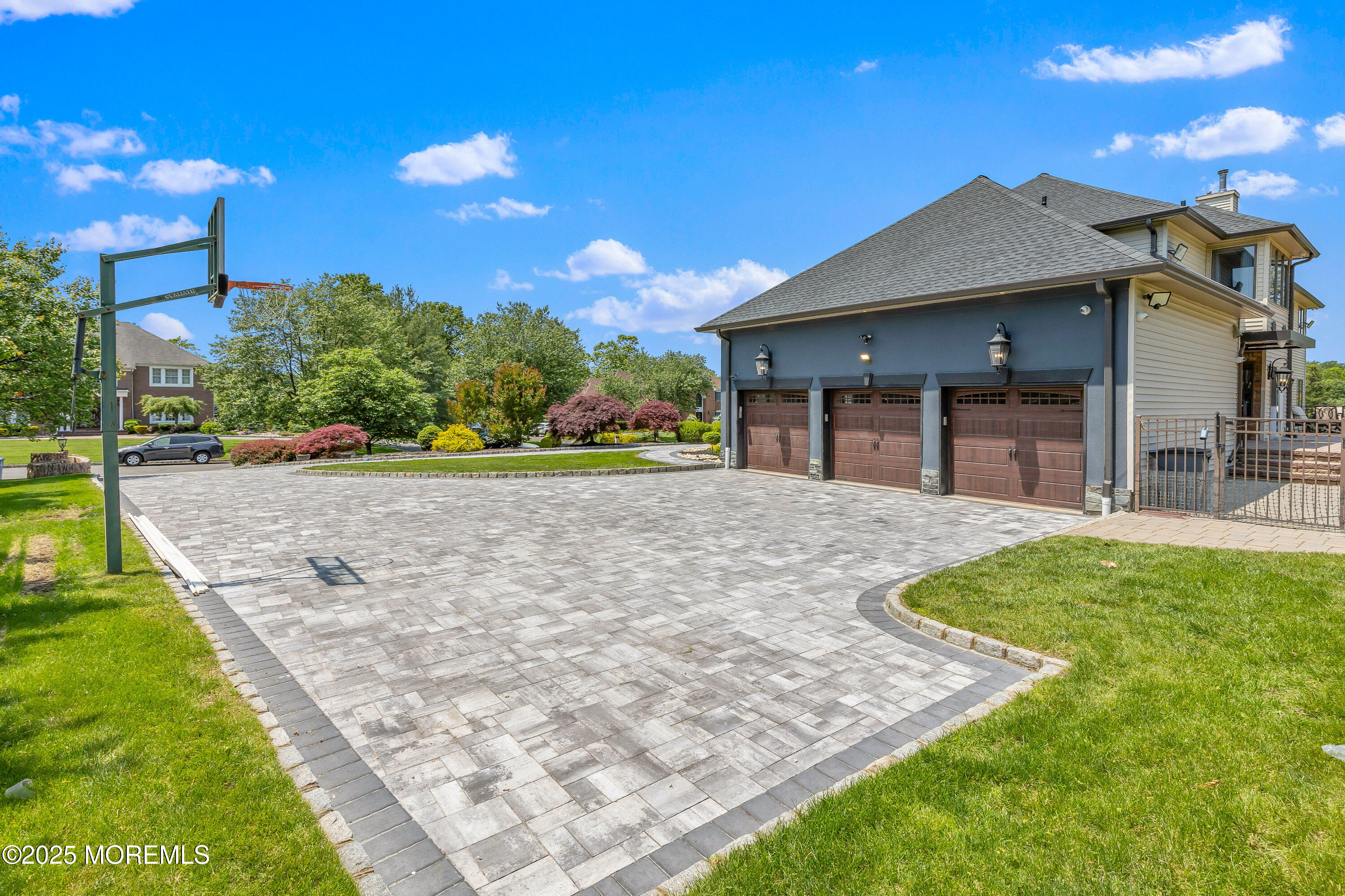 806 Turquoise Trail Morganville, NJ 07751 - Photo 56 of 62 a view of a house with a yard and potted plants