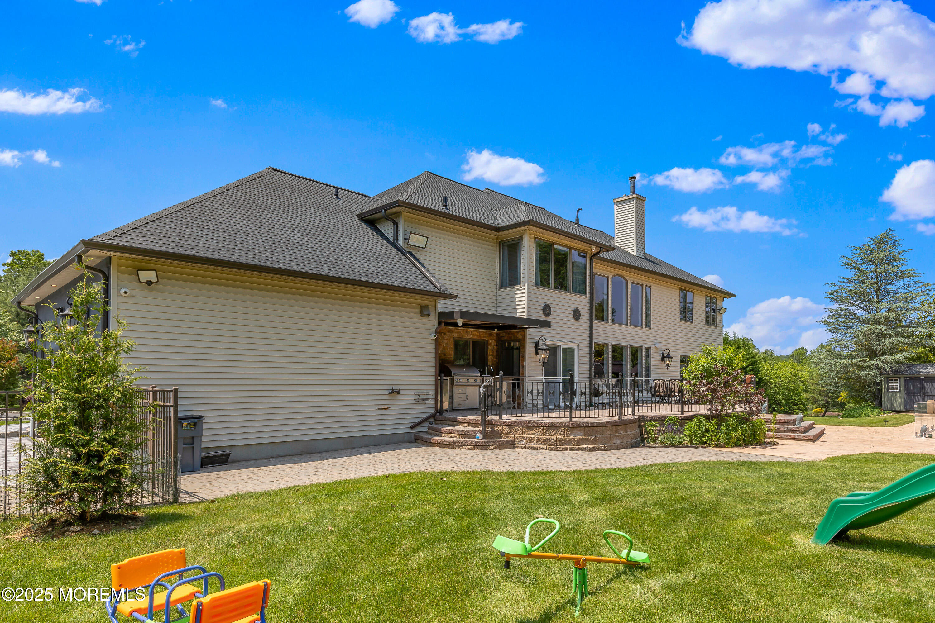 806 Turquoise Trail Morganville, NJ 07751 - Photo 62 of 62 a house view with swimming pool and sitting space