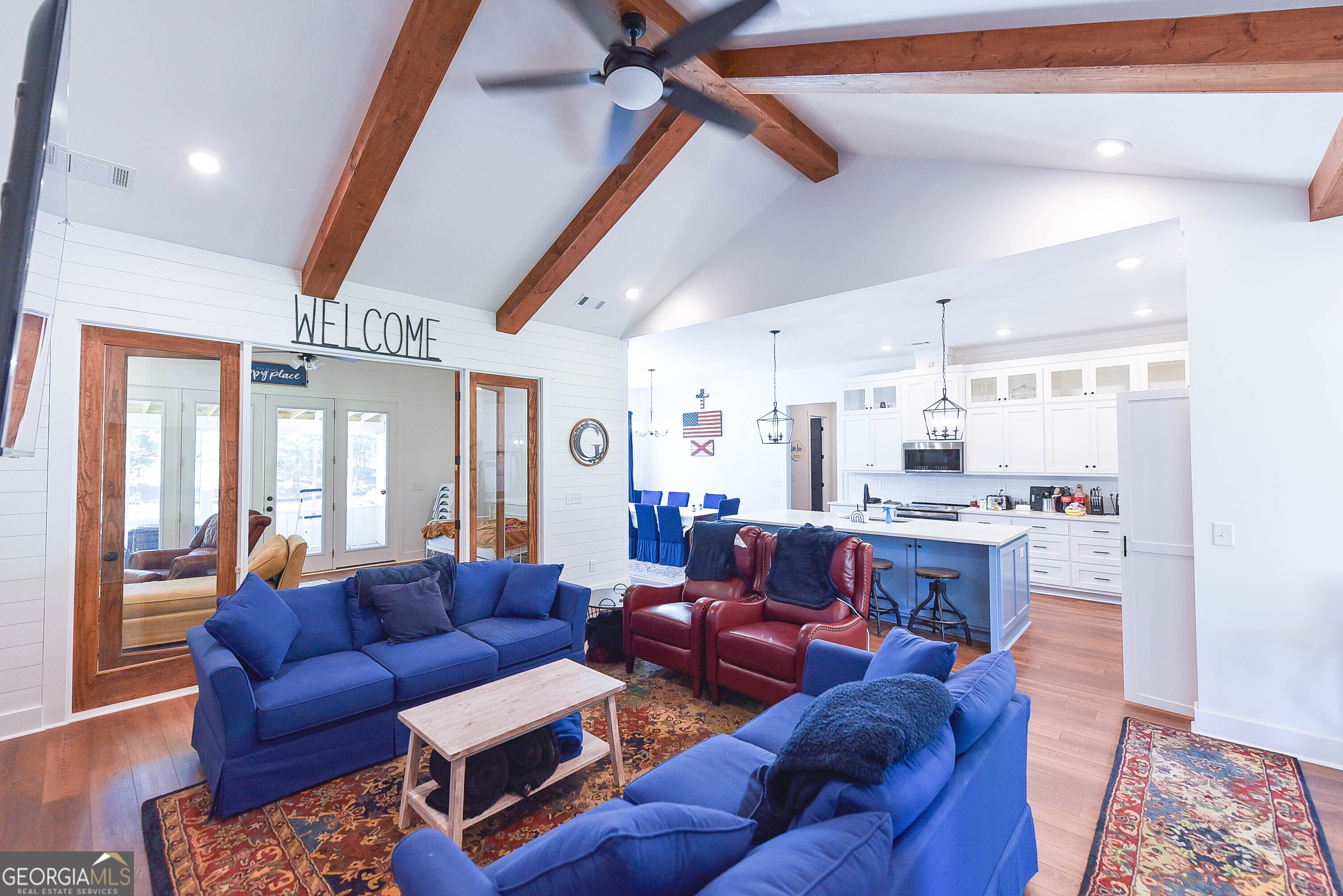 209 Lee Road Salem, AL 36874 - Photo 9 of 37 a living room with furniture a wooden floor and a chandelier