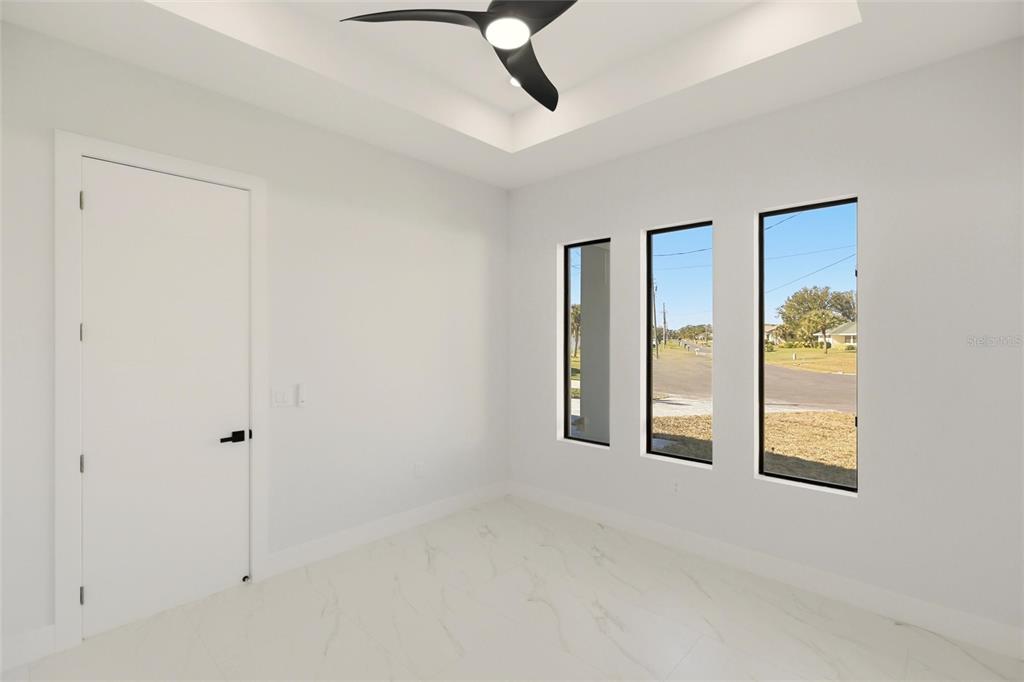 17 Long Meadow Road Rotonda West, FL 33947 - Photo 20 of 37 an empty room with windows and closet