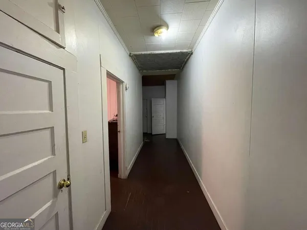 a bedroom with a bed and a flat tv screen