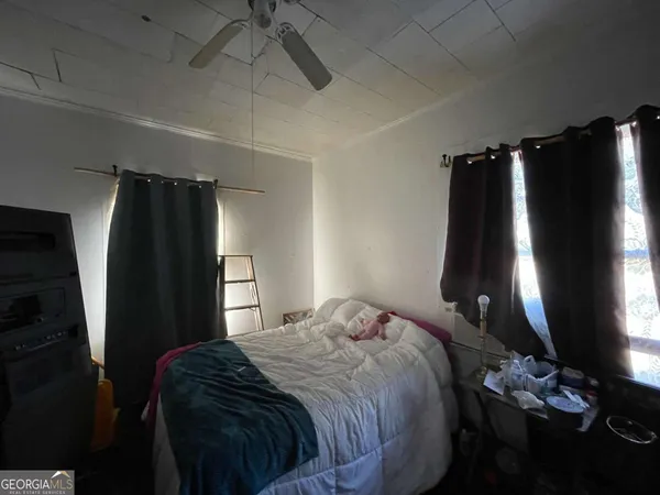 a room with lots of different colored cloths