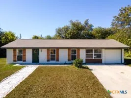 front view of a house and a yard