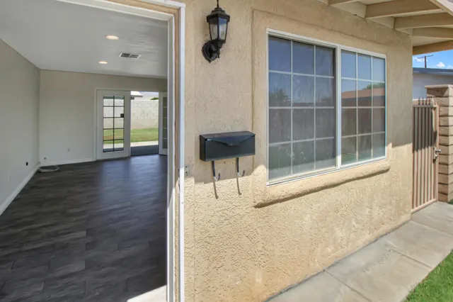 a view of an entryway with wooden floor and a window