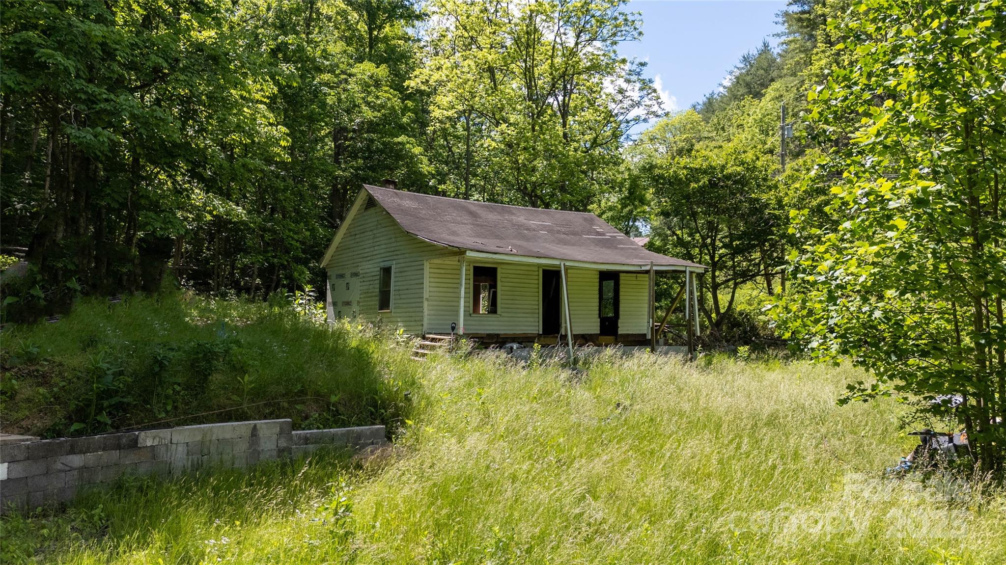 522 Deyton Road Bakersville, NC 28705 - Photo 3 of 11 a view of a house with pool and a yard