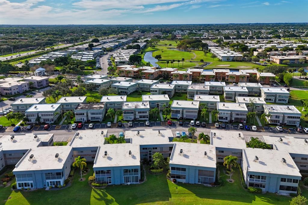 820 Flanders South, Unit 280 Delray Beach, FL 33484 - Photo 15 of 16 a view of multiple houses with outdoor space