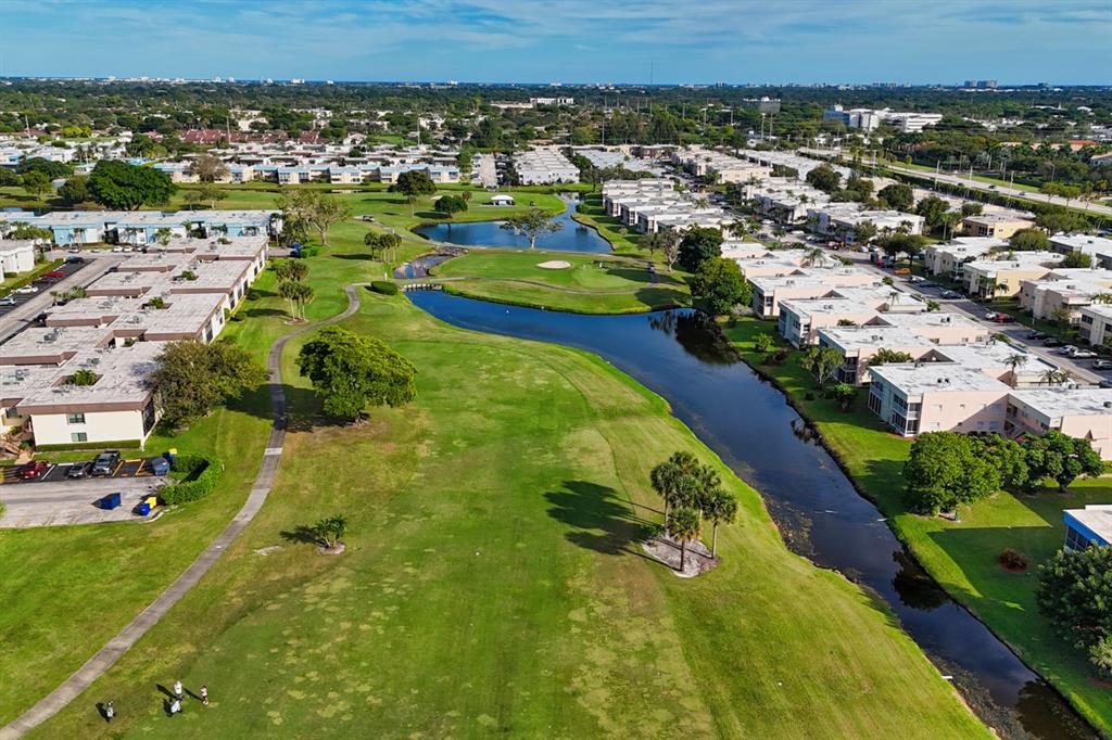 820 Flanders South, Unit 280 Delray Beach, FL 33484 - Photo 3 of 16 an aerial view of residential houses with outdoor space