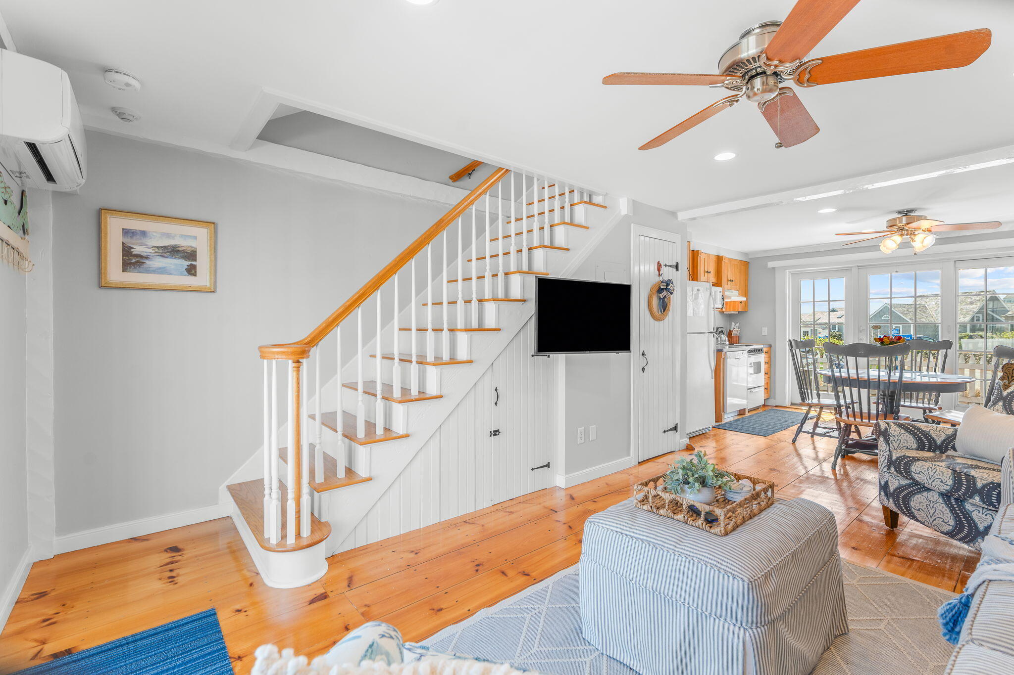 4 Race Point Road, Unit 4 Mashpee, MA 02649 - Photo 18 of 43 a living room with furniture a rug and white walls