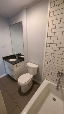 2409 Leon Street, Unit 301 Austin, TX 78705 - Photo 9 of 10 a bathroom with a toilet and a sink
