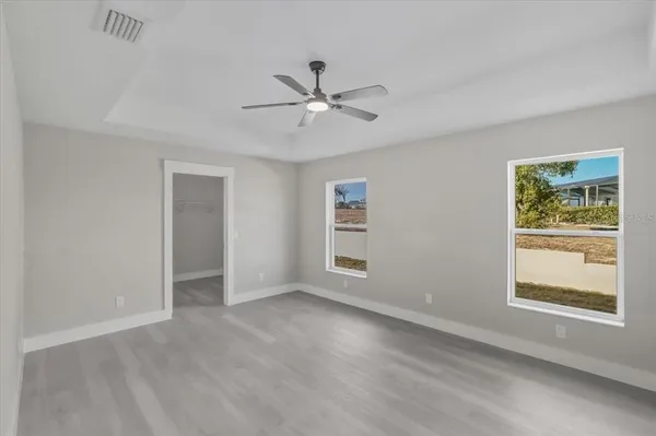 a bedroom with furniture and a chandelier
