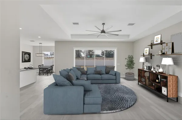 a view of an empty room with a kitchen