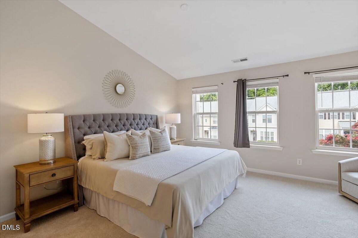 7734 Winners Edge Street Raleigh, NC 27617 - Photo 18 of 37 a bedroom with a bed and a window