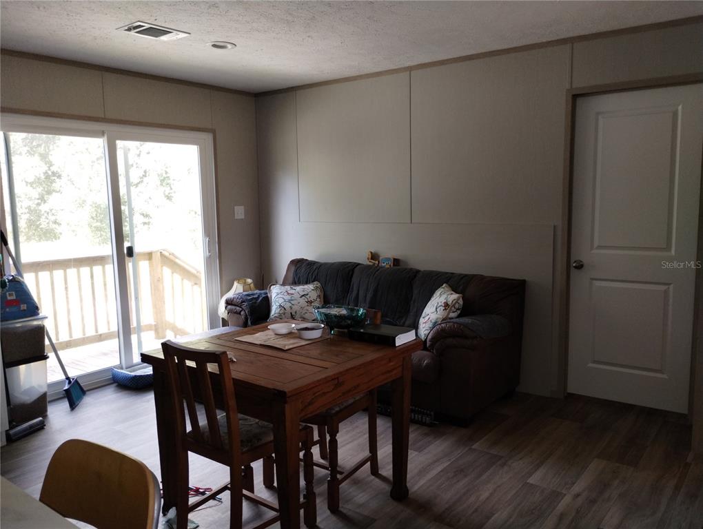 1826 Southeast 44th Place Bushnell, FL 33513 - Photo 16 of 29 a view of a workspace with furniture and a window