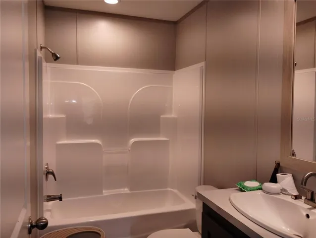 a bathroom with a bathtub and a sink