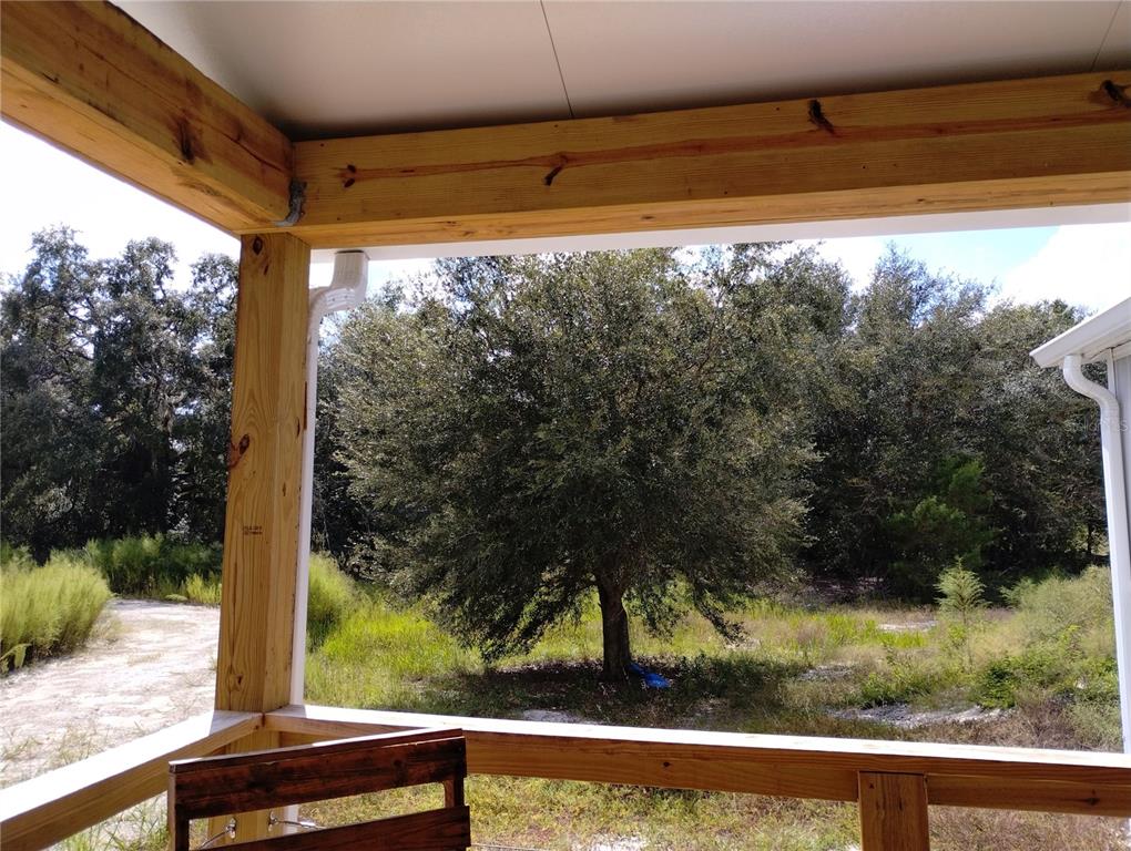 1826 Southeast 44th Place Bushnell, FL 33513 - Photo 27 of 29 a view of a yard from a window