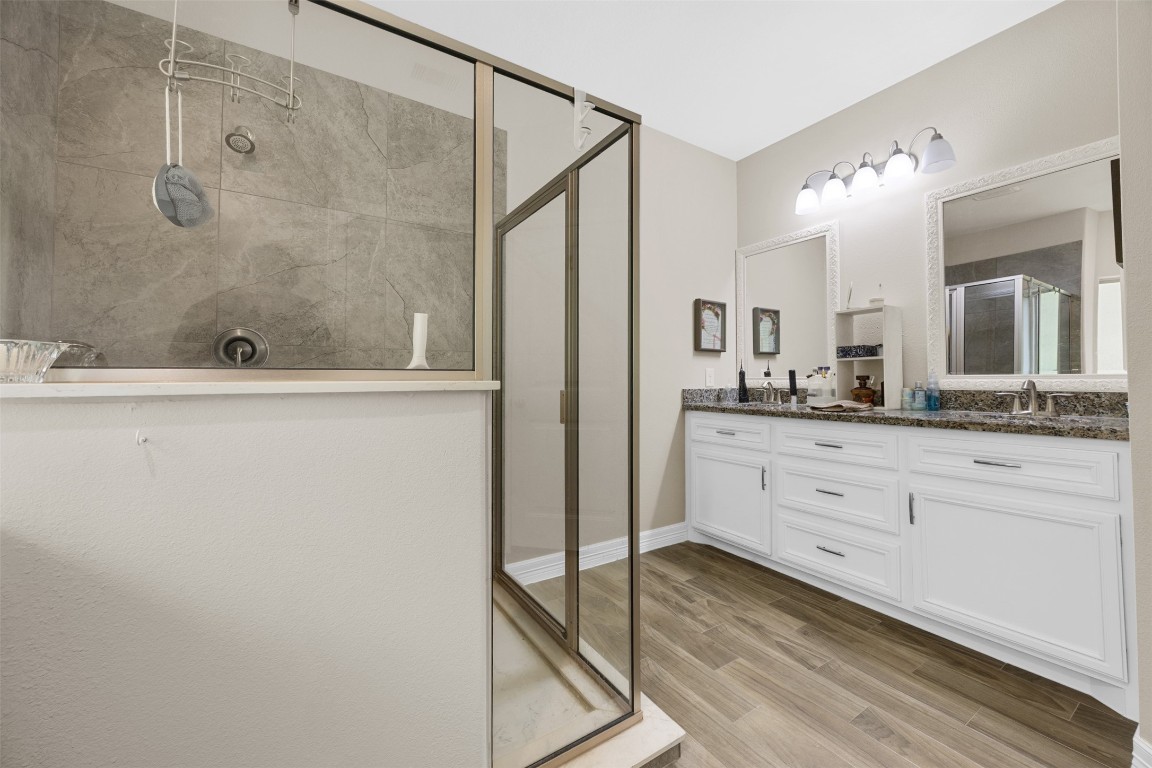 42 Trail Lake Trinity, TX 75862 - Photo 21 of 50 a bathroom with a granite countertop sink mirror and a shower