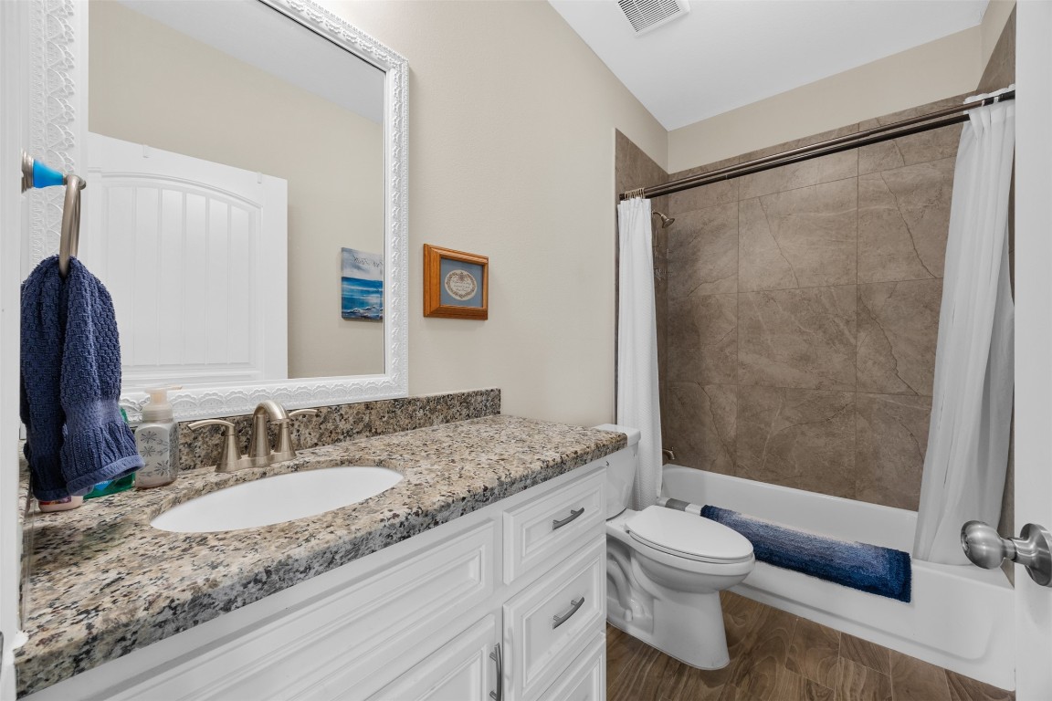 42 Trail Lake Trinity, TX 75862 - Photo 24 of 50 a bathroom with a granite countertop sink toilet and shower