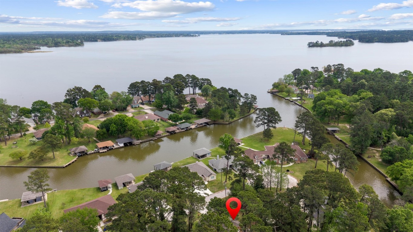 42 Trail Lake Trinity, TX 75862 - Photo 33 of 50 a view of a lake with a houses