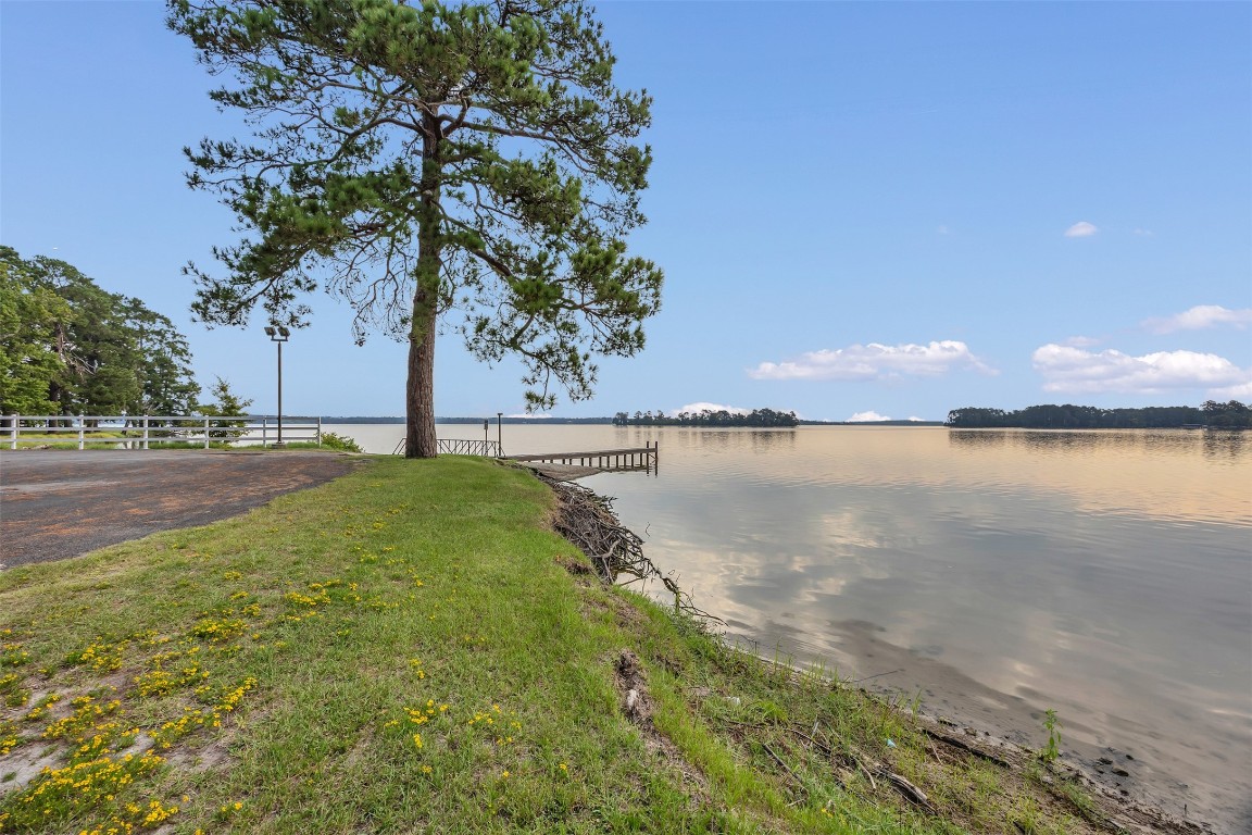 42 Trail Lake Trinity, TX 75862 - Photo 48 of 50 a view of a lake with a big yard