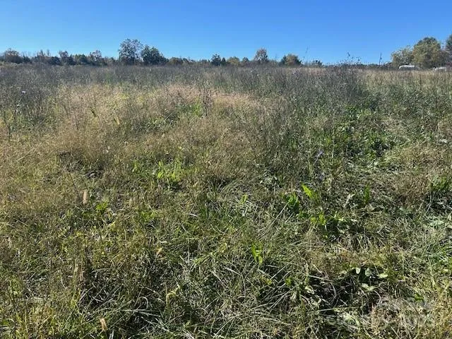 a view of a lake with houses in the back