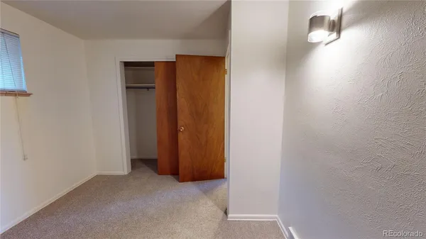 a view of hallway with closet