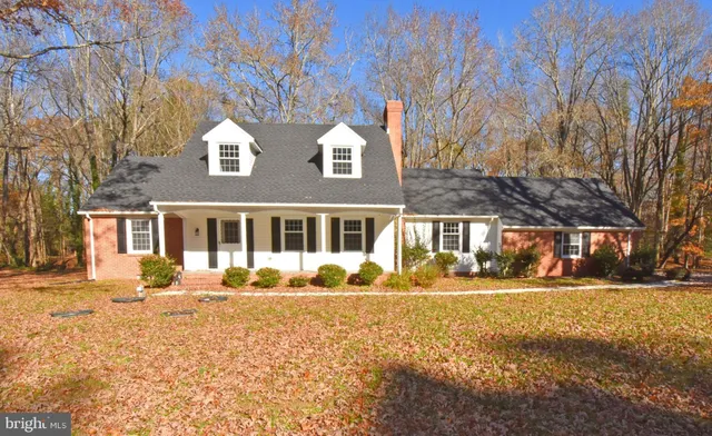 a front view of a building with a yard