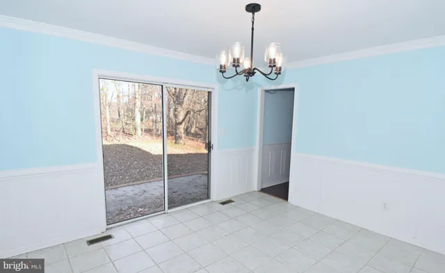 a white toilet sitting next to a bath tub window