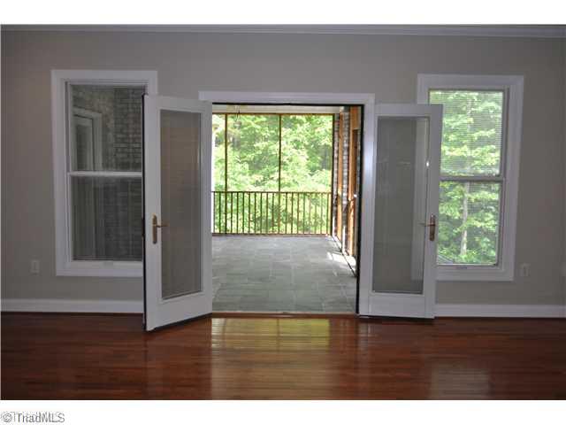 2500 Lakes Edge High Point High Point, NC 27265 - Photo 12 of 16 Master Bedroom. French doors to screened-in back porch