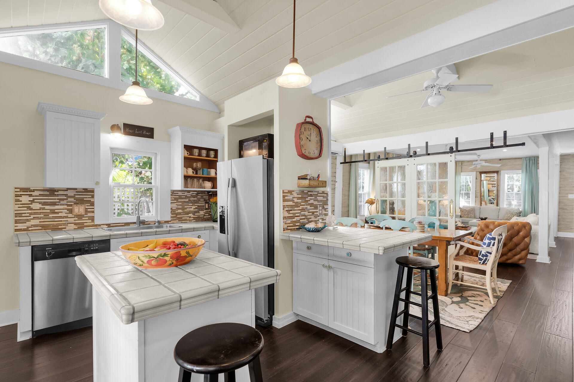 1109 Stump Lane Key West, FL 33040 - Photo 14 of 46 a kitchen that has a lot of cabinets in it and wooden floors
