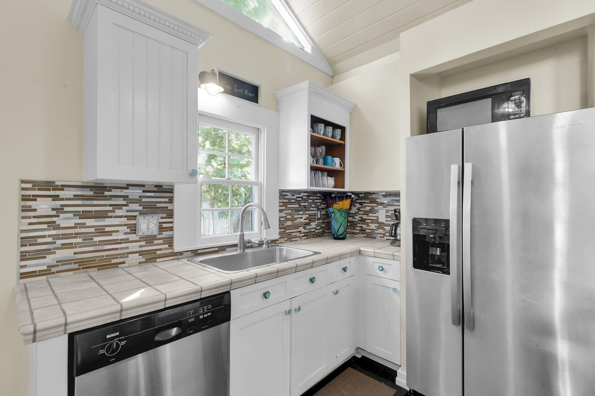 1109 Stump Lane Key West, FL 33040 - Photo 16 of 46 a kitchen with a refrigerator and a sink
