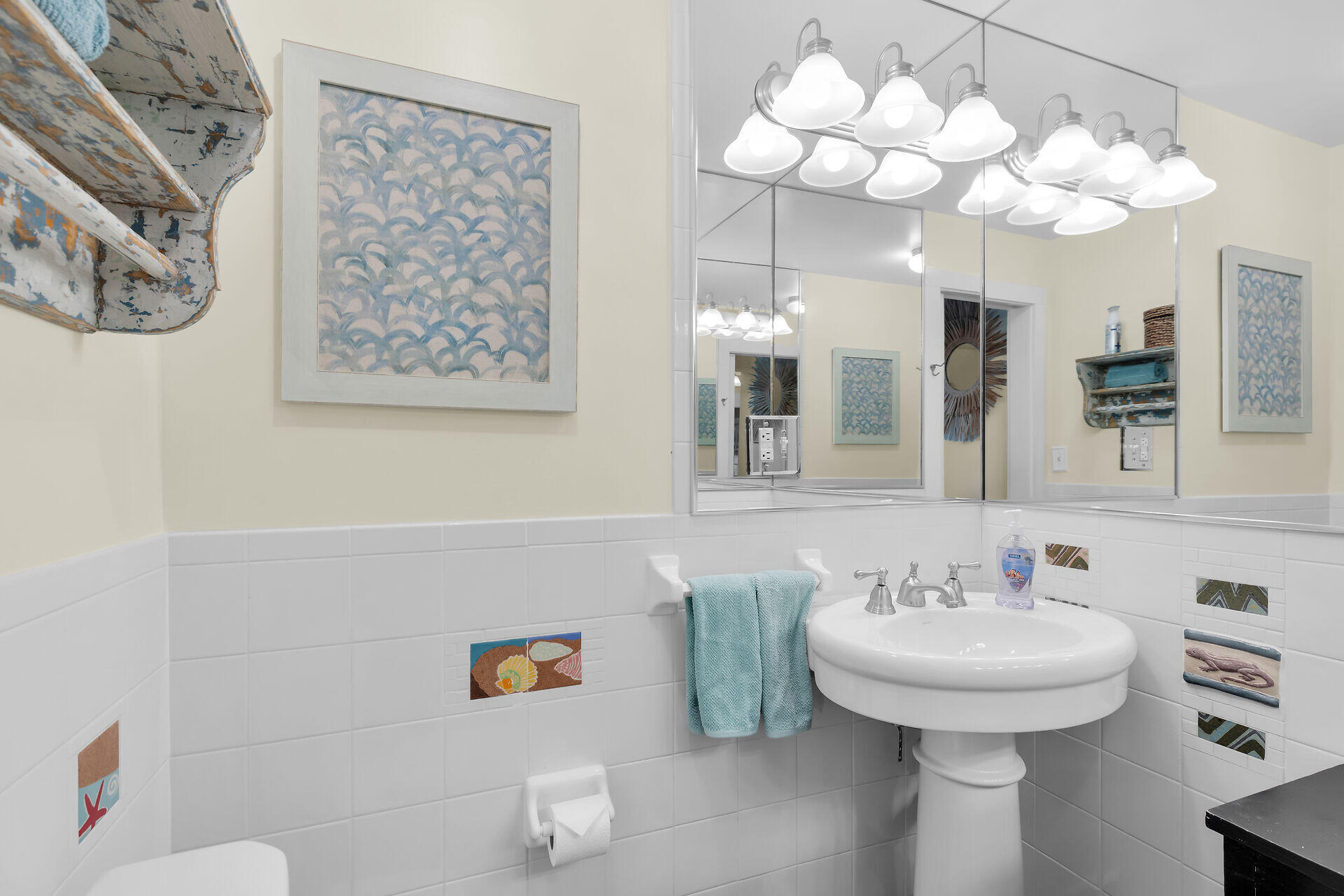 1109 Stump Lane Key West, FL 33040 - Photo 17 of 46 a bathroom with a sink a mirror and a toilet