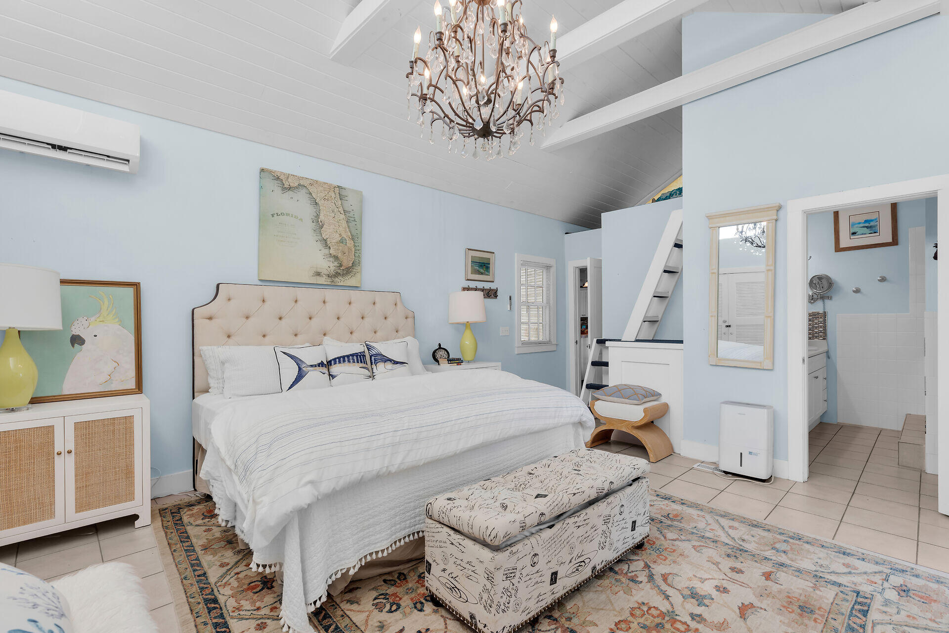 1109 Stump Lane Key West, FL 33040 - Photo 20 of 46 a bedroom with a bed and a chandelier