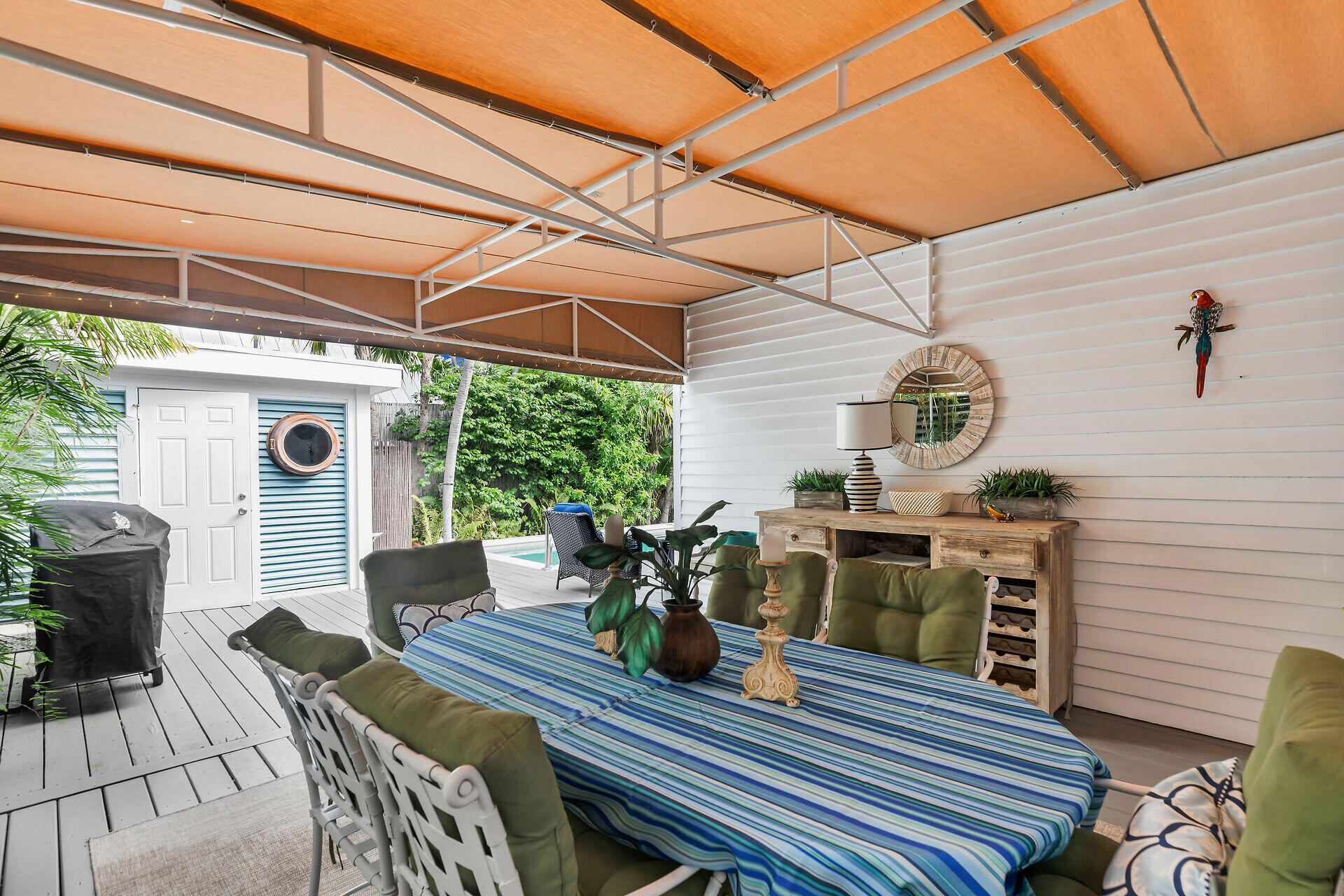 1109 Stump Lane Key West, FL 33040 - Photo 24 of 46 a view of a dining table and chairs in the patio