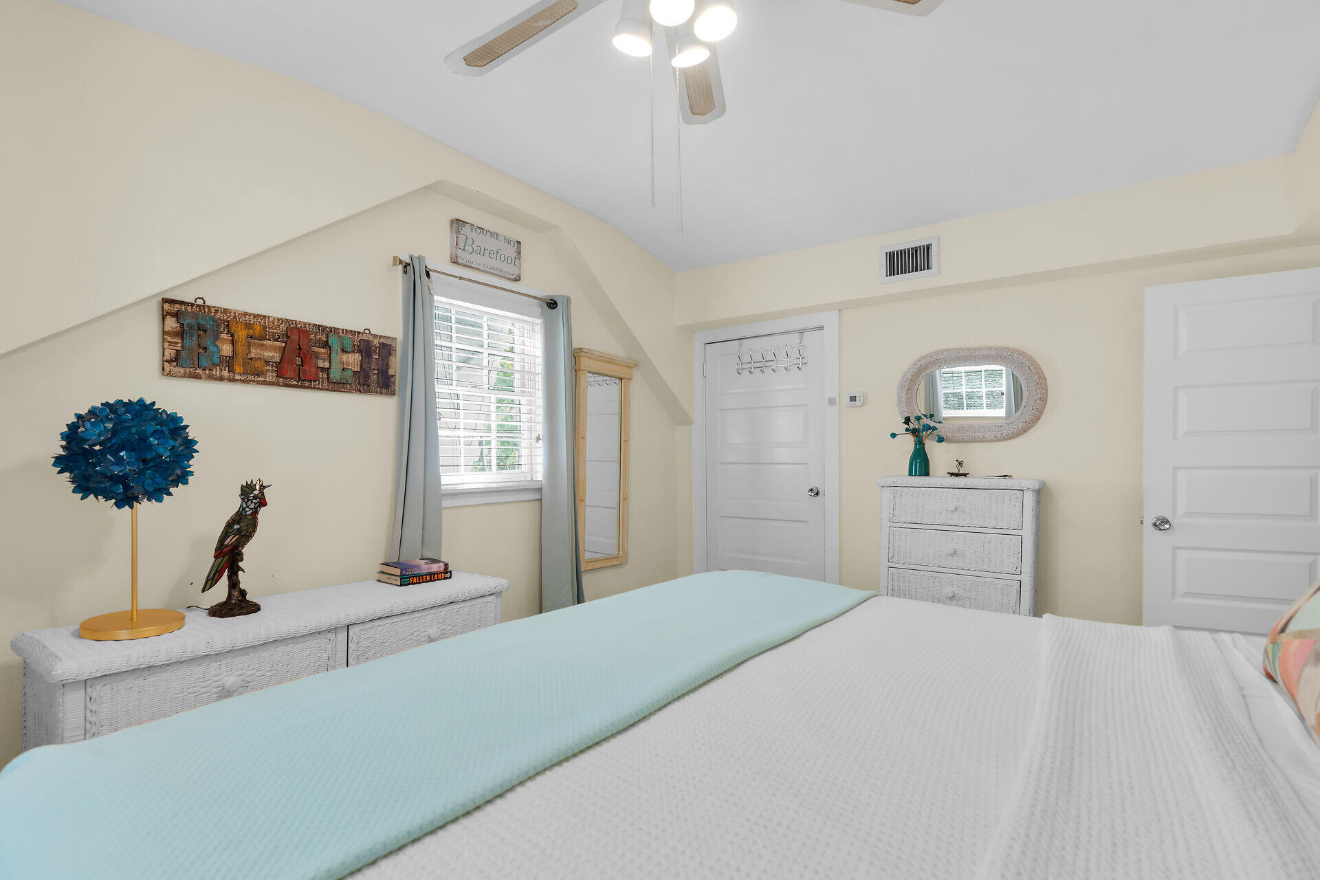 1109 Stump Lane Key West, FL 33040 - Photo 38 of 46 a bedroom with a bed and a chandelier