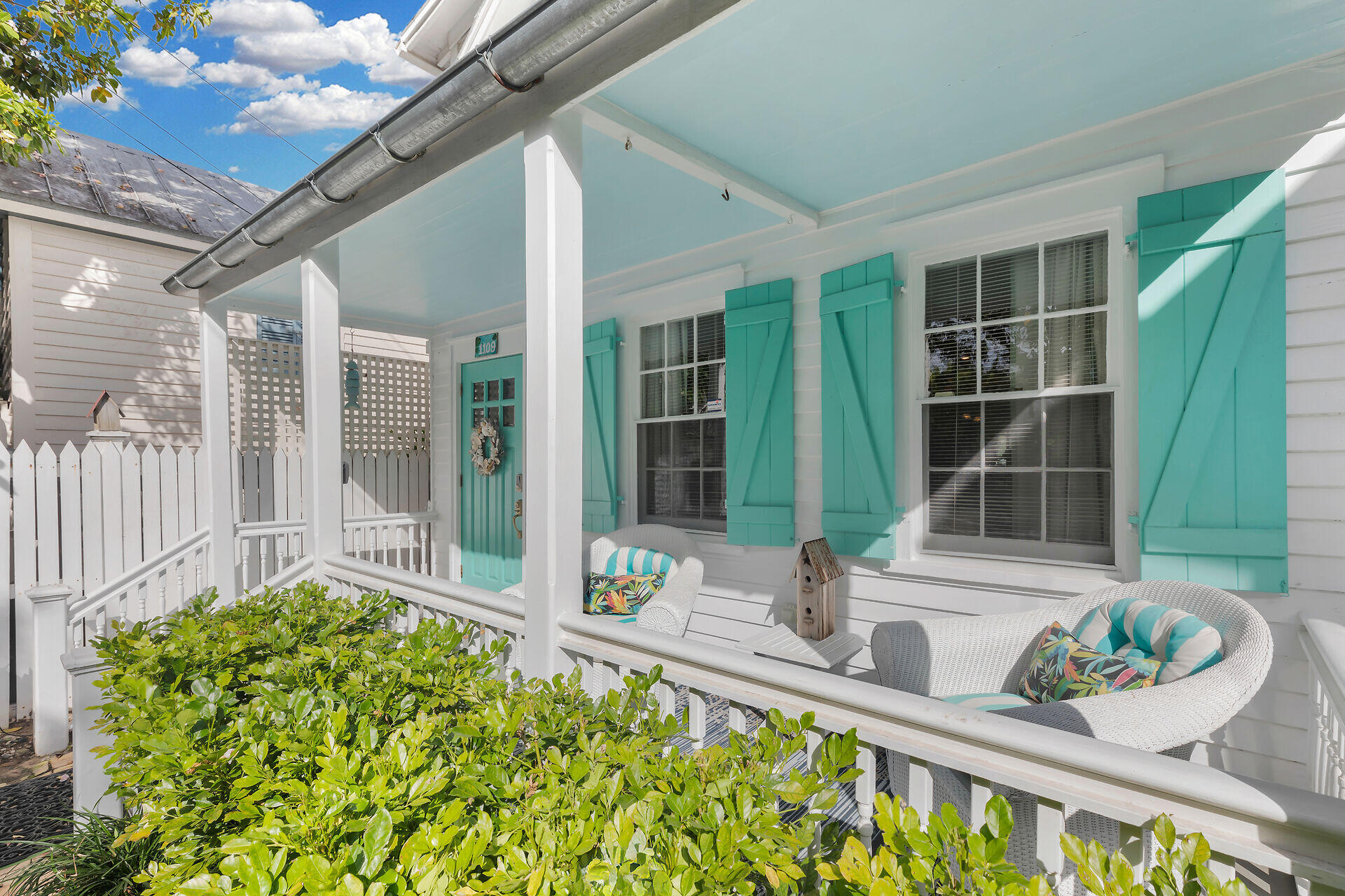 1109 Stump Lane Key West, FL 33040 - Photo 4 of 46 a front view of a house with outdoor seating