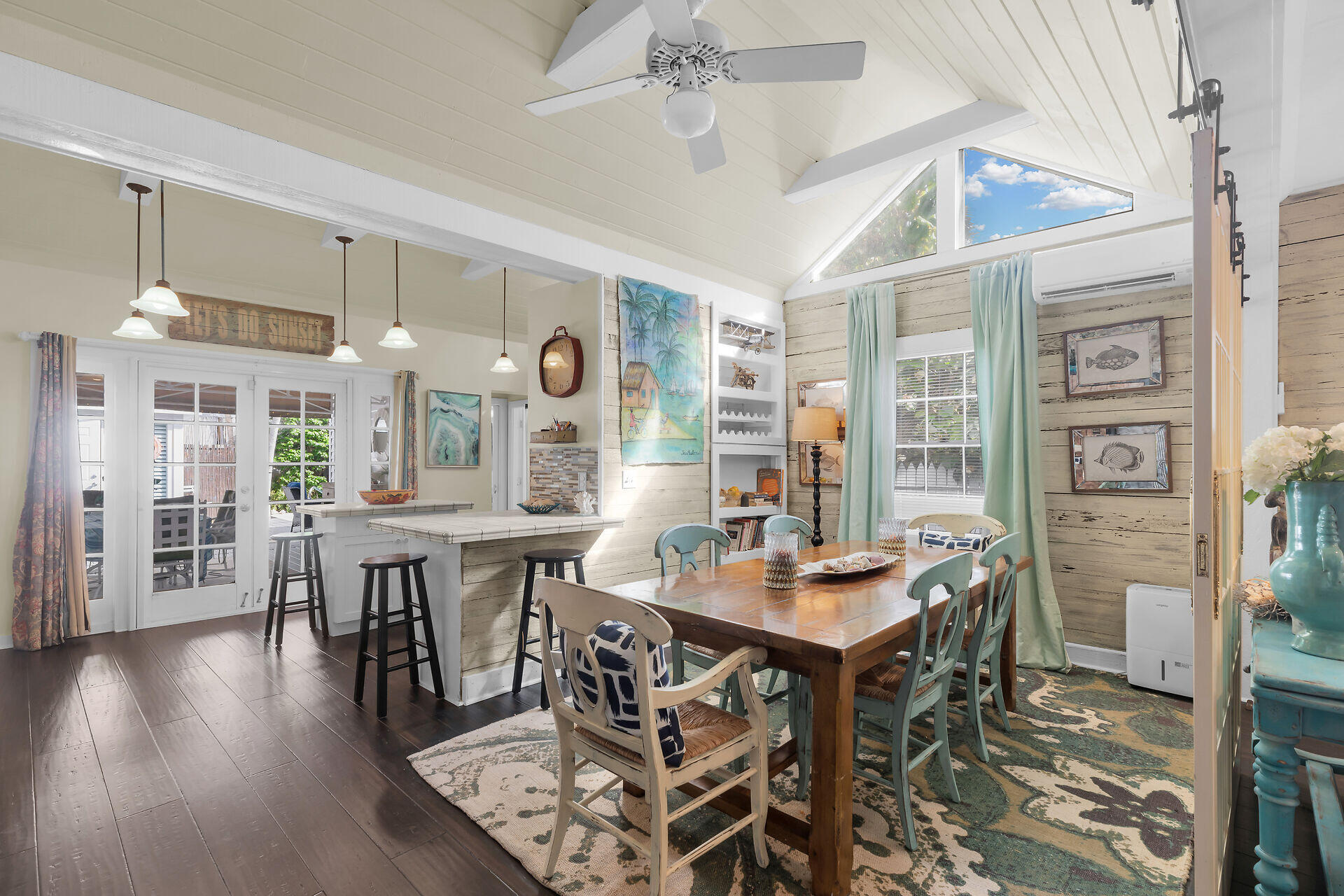 1109 Stump Lane Key West, FL 33040 - Photo 10 of 46 a view of a dining room with furniture and wooden floor