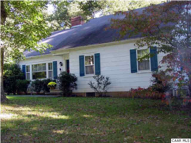 505 Campbell Road Keswick, VA 22947 - Photo 3 of 7 a front view of a house with a garden and yard