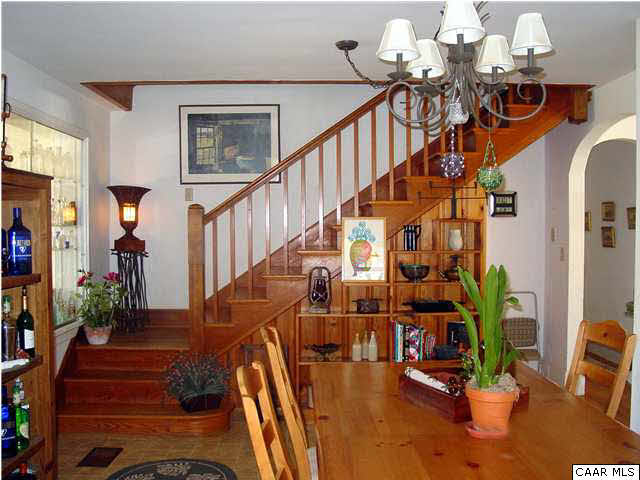 505 Campbell Road Keswick, VA 22947 - Photo 5 of 7 a view of staircase with lots of frames on wall and wooden floor