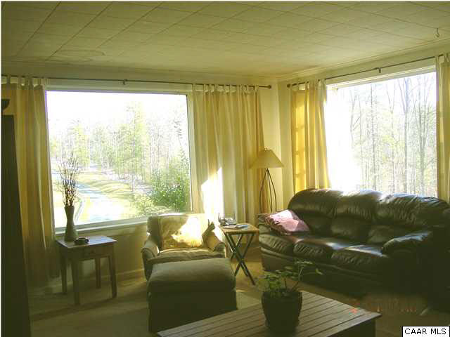 505 Campbell Road Keswick, VA 22947 - Photo 7 of 7 a living room with furniture and a large window