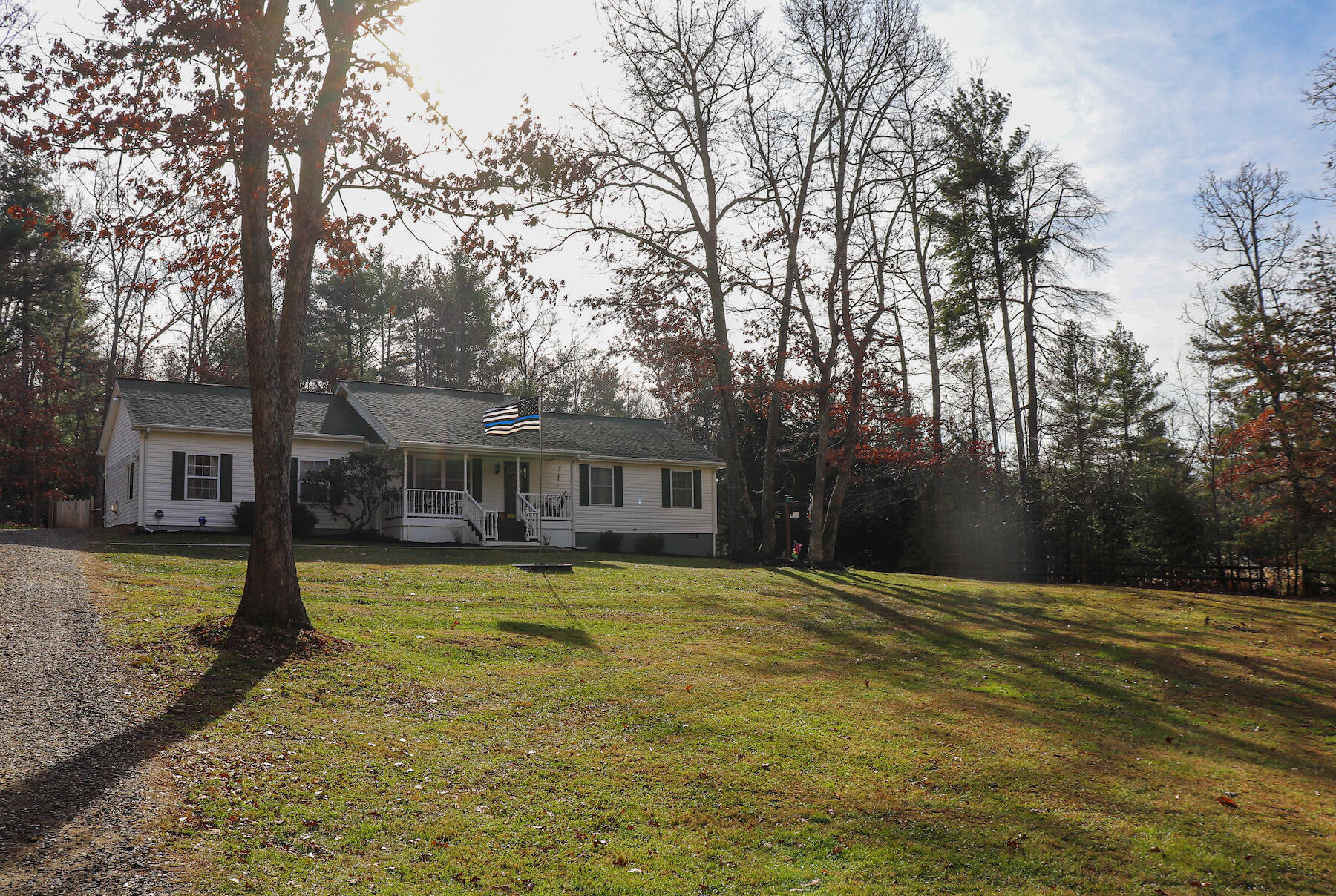 1008 Dusty Rock Road Northwest Riner, VA 24149 - Photo 2 of 28 a house that has a tree in front of it
