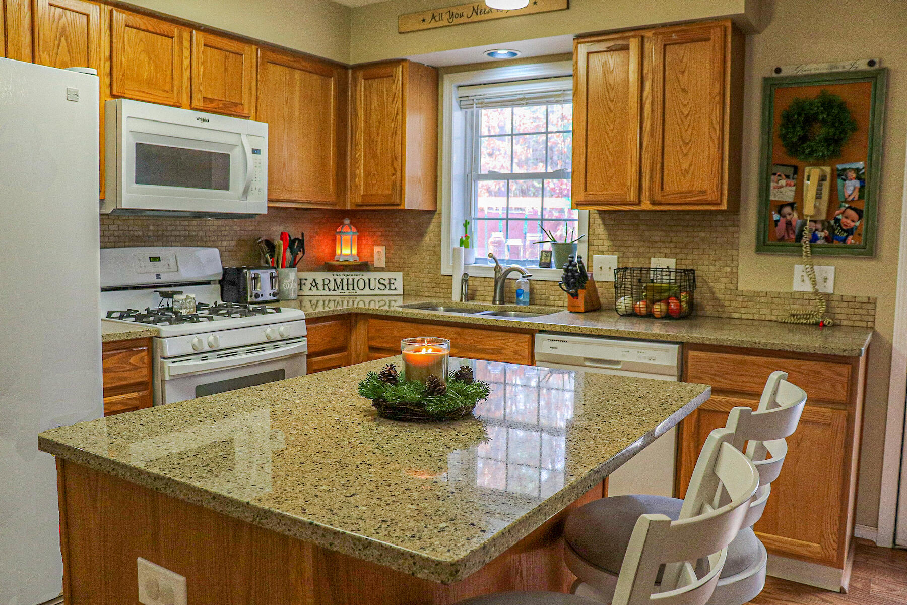 1008 Dusty Rock Road Northwest Riner, VA 24149 - Photo 14 of 28 a kitchen with a stove a sink and a microwave
